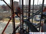 Installaing weather strips at the Monumental Stairs Curtain Wall Facing South.jpg